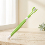 Brosse Quenott vert clair et blanc sur fond crème lumineux